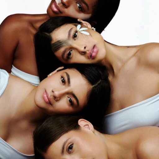 Women with their radiant skin posing together, showcasing diverse beauty and skincare.